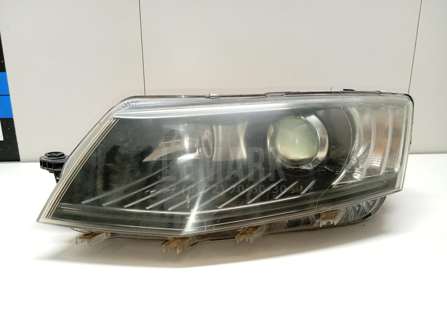 Фара левая 5ED941017A VAG