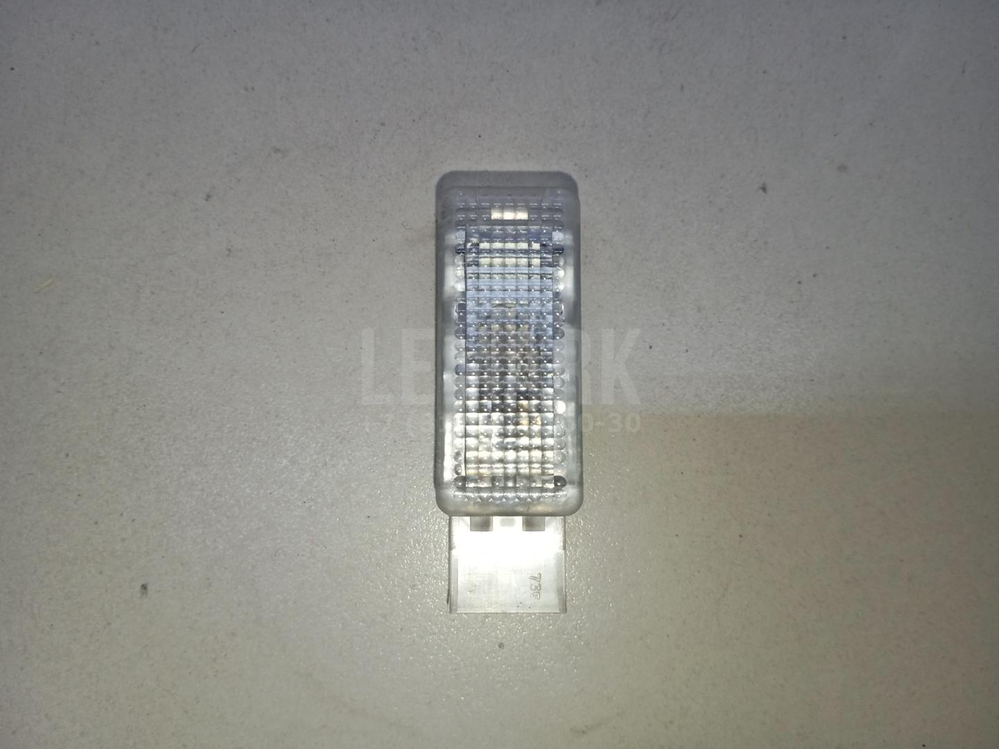 Фонарь подсветки двери 6L0947565 VAG