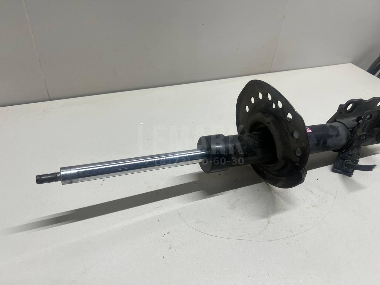 Амортизатор передний левый E43033UB1A Nissan