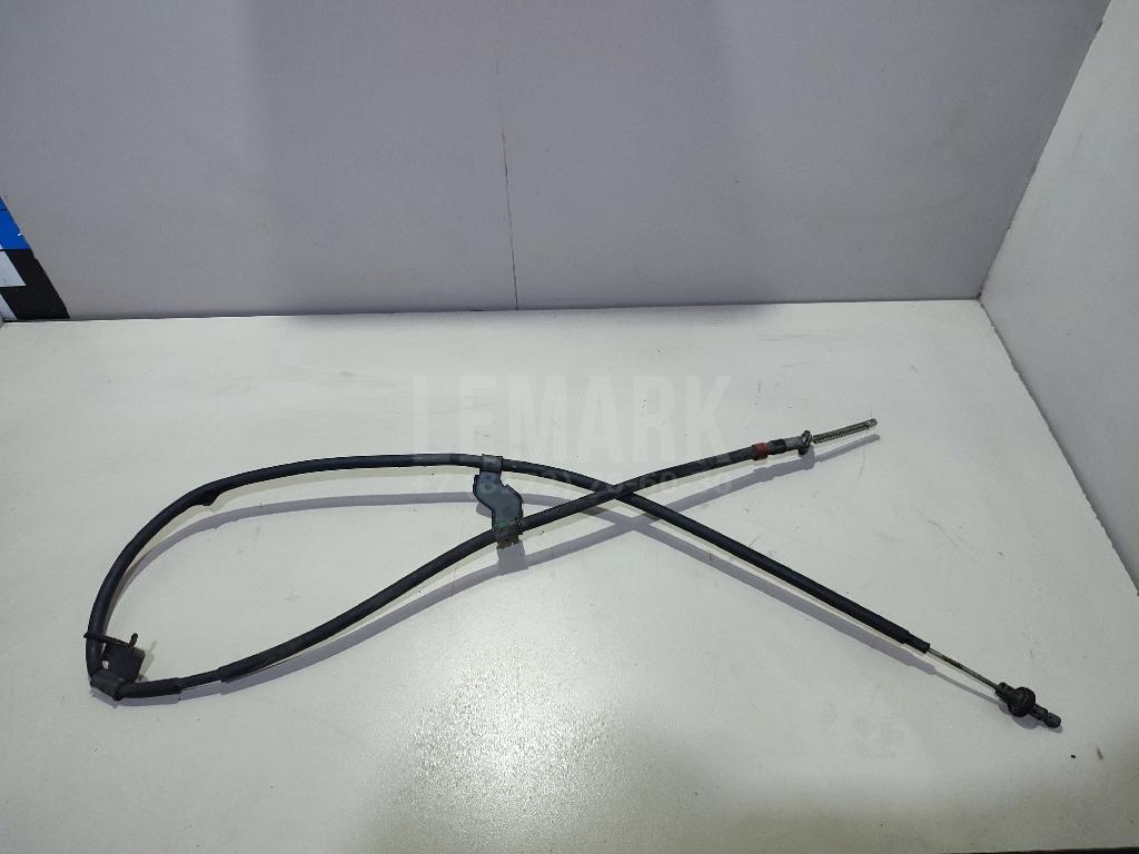 Трос стояночного тормоза левый 36531JD00A Nissan