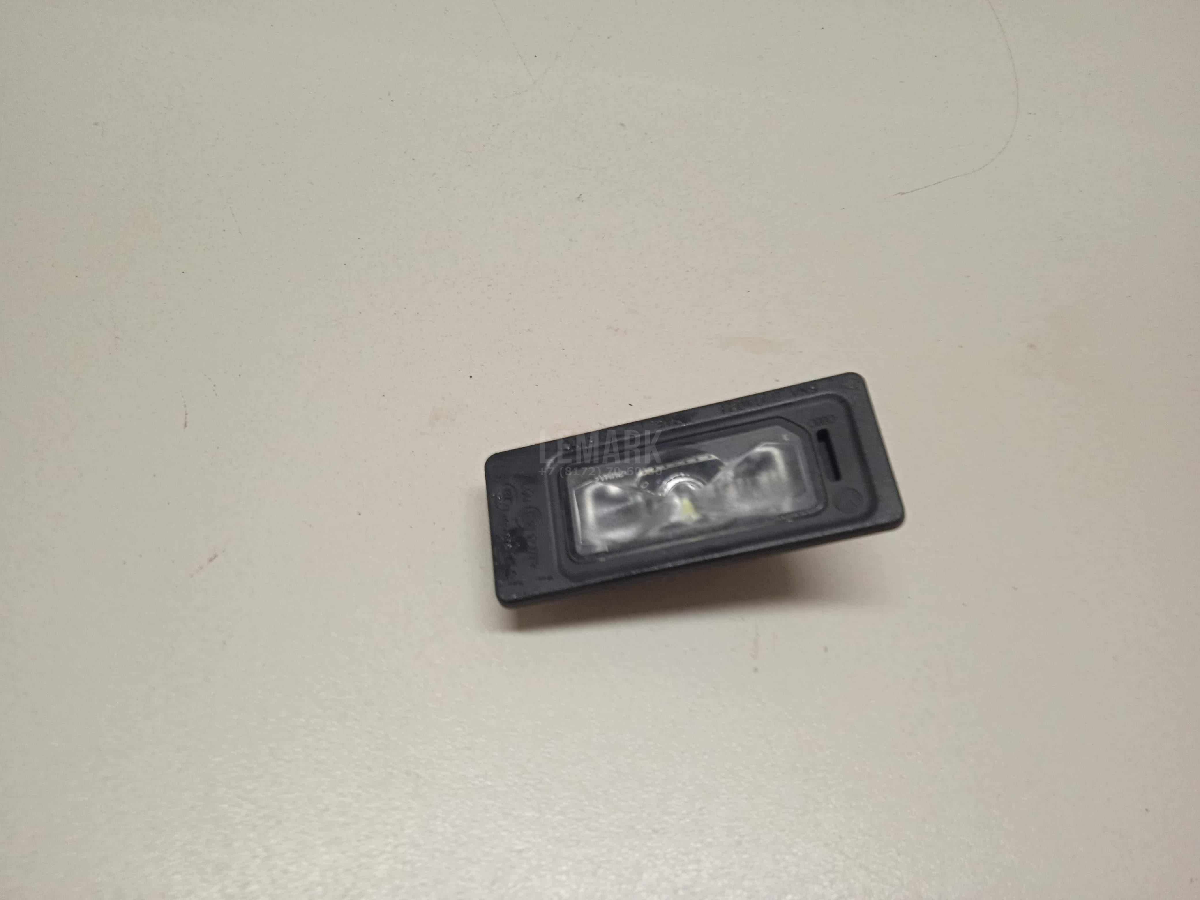 Фонарь подсветки номера 5NA943021 VAG