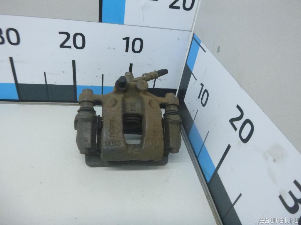 Суппорт тормозной задний левый