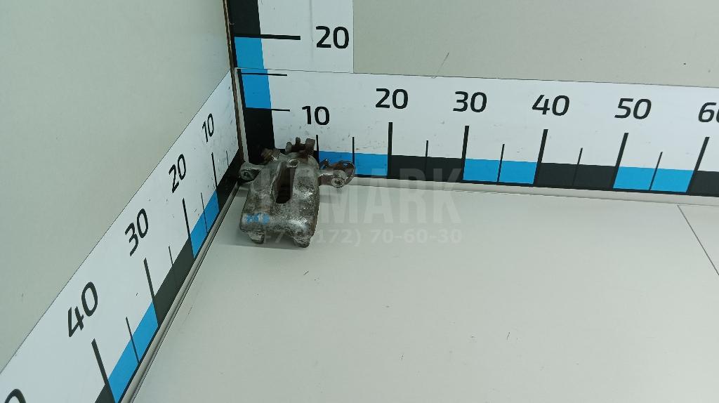 Суппорт тормозной задний левый 542126 GM