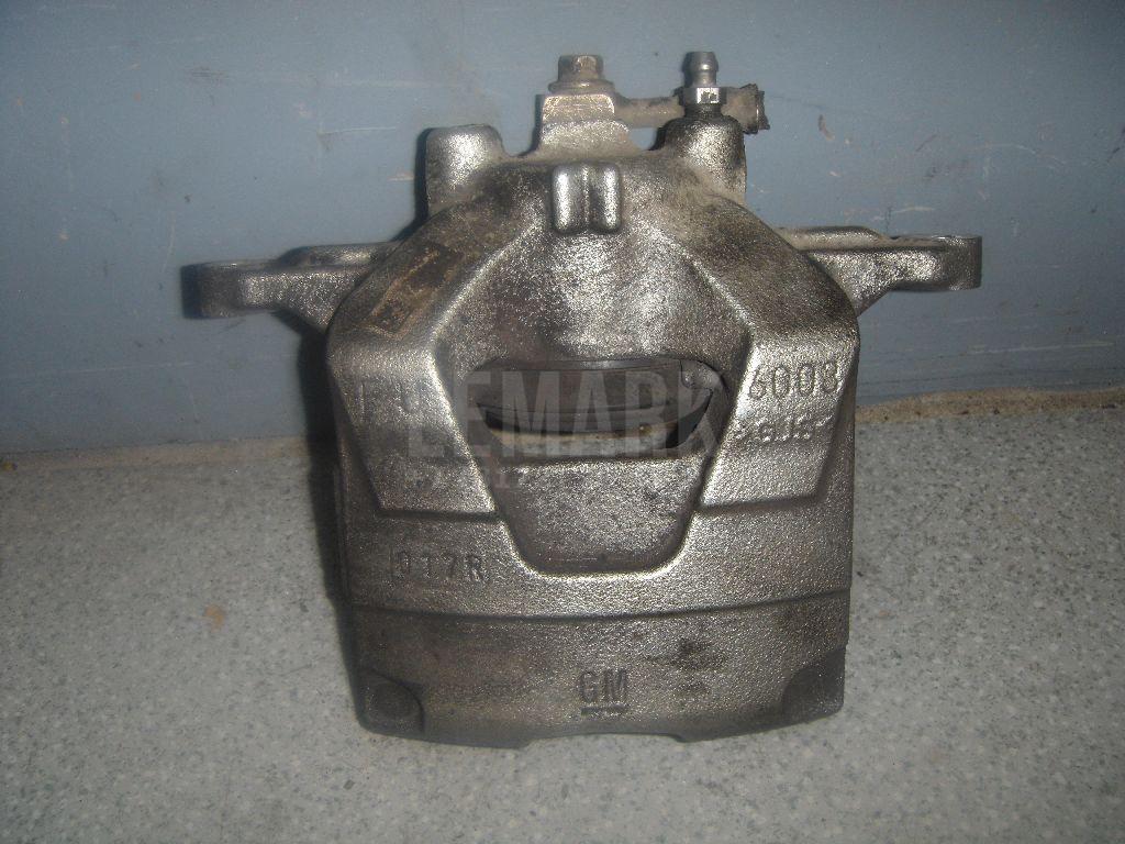 Суппорт тормозной передний левый 13301226 GM