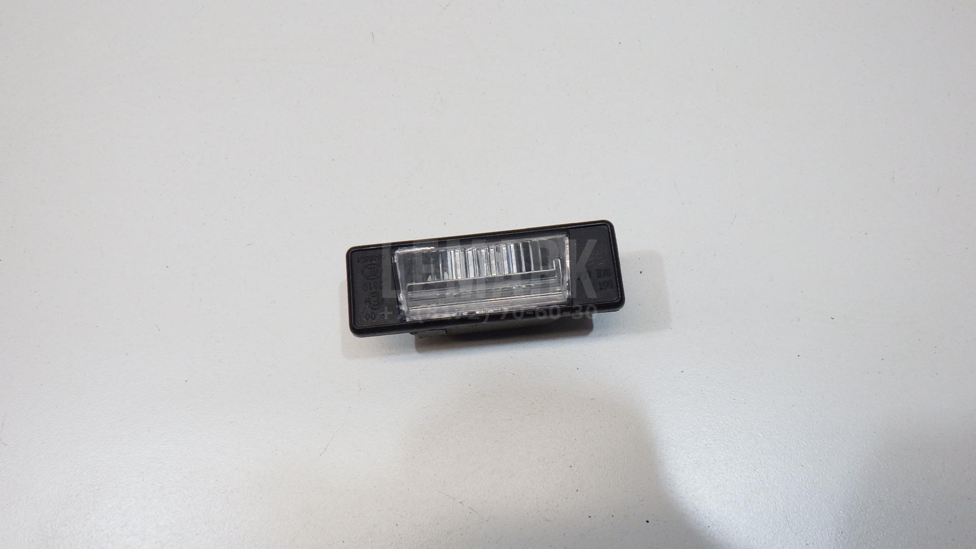 Фонарь подсветки номера 265108990A Nissan