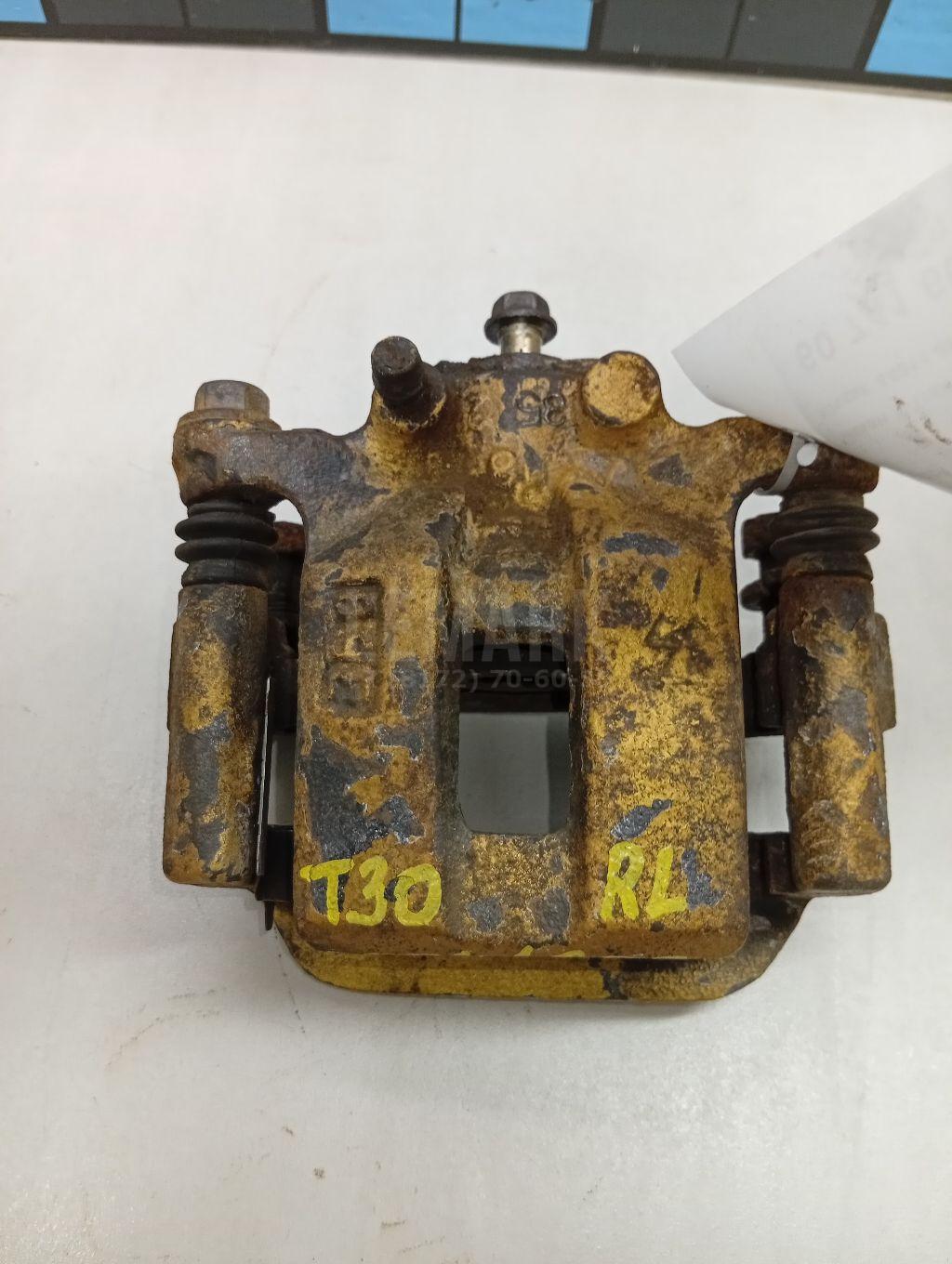 Суппорт тормозной задний левый 440118H30A Nissan