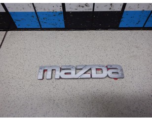 Эмблема на крышку багажника для Mazda 626 (GF) 1997-2002 с разбора состояние хорошее