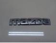 Эмблема на крышку багажника Mazda G21B-51-711