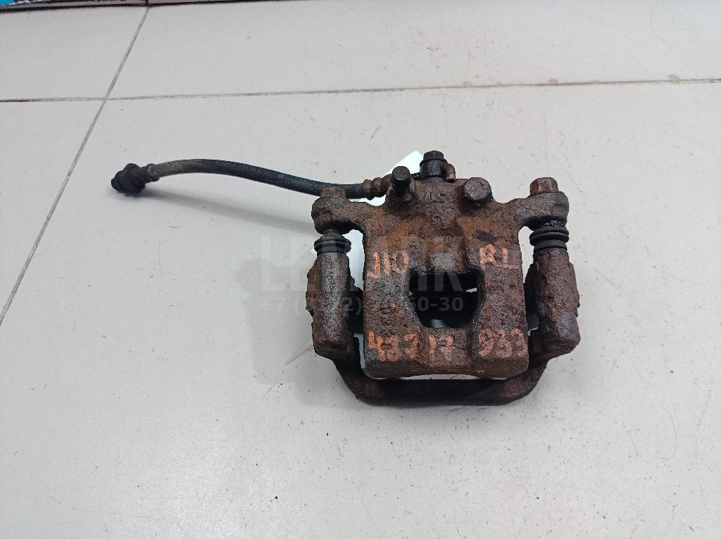 Суппорт тормозной задний левый 44011EM11A Nissan